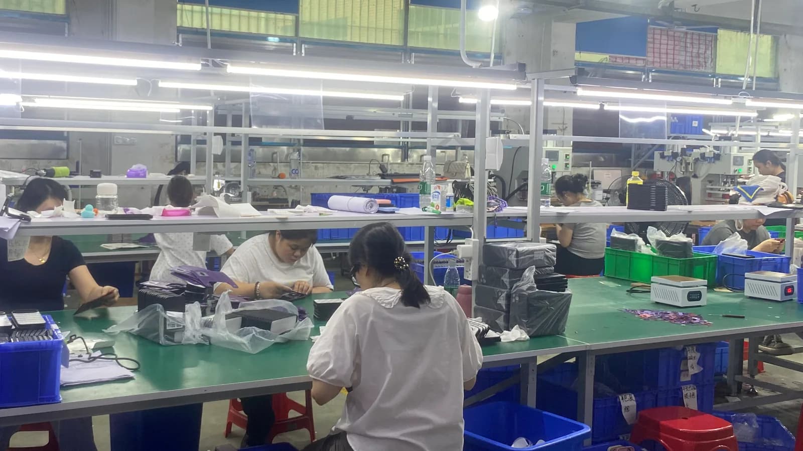 Team members carrying out a manual product quality inspection
